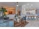 Modern kitchen with white cabinets and a large island at 15538 W Whitton Ave, Goodyear, AZ 85395