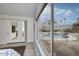 Bedroom with large window showcasing pool and backyard views at 15538 W Whitton Ave, Goodyear, AZ 85395