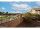 View of a community pool area with a brick wall and walkway at 16036 N 11Th Ave # 1140, Phoenix, AZ 85023