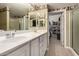 Double vanity bathroom with a walk-in shower and ample closet space at 16450 E Ave Of The Fountains -- # 23, Fountain Hills, AZ 85268