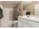 Clean bathroom with shower/tub combo, white vanity, and updated fixtures at 16450 E Ave Of The Fountains -- # 23, Fountain Hills, AZ 85268