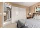 Bedroom with double door closet and access to hallway at 16450 E Ave Of The Fountains -- # 23, Fountain Hills, AZ 85268