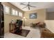 Bright home office features built-in shelving and a comfortable sitting area at 16450 E Ave Of The Fountains -- # 23, Fountain Hills, AZ 85268