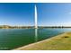 Large lake fountain with calm water and green grass at 16450 E Ave Of The Fountains -- # 23, Fountain Hills, AZ 85268