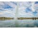 Tall water fountain in a lake with residential homes in the background at 16450 E Ave Of The Fountains -- # 23, Fountain Hills, AZ 85268
