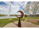 Lake view featuring a unique metal sculpture and water fountain at 16450 E Ave Of The Fountains -- # 23, Fountain Hills, AZ 85268
