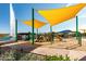 Playground with shade sails near a lake and fountain at 16450 E Ave Of The Fountains -- # 23, Fountain Hills, AZ 85268