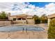 Community pool with covered patio and surrounding landscape at 16450 E Ave Of The Fountains -- # 23, Fountain Hills, AZ 85268