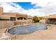 Community pool with covered patio and surrounding landscape at 16450 E Ave Of The Fountains -- # 23, Fountain Hills, AZ 85268