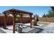 Relaxing backyard patio with pergola, table, chairs, and built-in grill at 1807 W Sierra Sunset Trl, Phoenix, AZ 85085