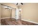 Bedroom with mirrored closet doors and wood-look flooring at 1807 W Sierra Sunset Trl, Phoenix, AZ 85085