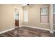 Bright bedroom with wood-look floors and en-suite bathroom access at 1807 W Sierra Sunset Trl, Phoenix, AZ 85085