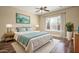 Bright bedroom with a king-size bed, wood floors, and large window at 1807 W Sierra Sunset Trl, Phoenix, AZ 85085