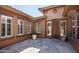Private courtyard entry with tile flooring and potted plants at 1807 W Sierra Sunset Trl, Phoenix, AZ 85085