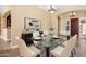 Elegant dining room with a glass table and chandelier at 1807 W Sierra Sunset Trl, Phoenix, AZ 85085