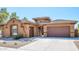 Beautiful two-story home with a three-car garage and desert landscaping at 1807 W Sierra Sunset Trl, Phoenix, AZ 85085