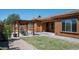 Home exterior view with backyard access and attractive landscaping at 1807 W Sierra Sunset Trl, Phoenix, AZ 85085