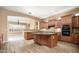 Open kitchen with large island and granite countertops at 1807 W Sierra Sunset Trl, Phoenix, AZ 85085