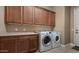 Laundry room with ample cabinet space and washer/dryer included at 1807 W Sierra Sunset Trl, Phoenix, AZ 85085