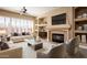 Spacious living room with a fireplace and built-in shelving at 1807 W Sierra Sunset Trl, Phoenix, AZ 85085