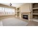 Living room featuring a fireplace and built-in shelving at 1807 W Sierra Sunset Trl, Phoenix, AZ 85085