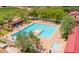 Community pool and spa with lounge chairs and shaded areas at 1807 W Sierra Sunset Trl, Phoenix, AZ 85085