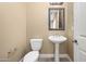Powder room with pedestal sink and decorative mirror at 1807 W Sierra Sunset Trl, Phoenix, AZ 85085
