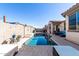 Inviting backyard oasis featuring a refreshing pool, patio furniture, and a covered patio at 18254 W Via Montoya Dr, Surprise, AZ 85387