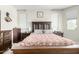 Spacious bedroom with a large bed and dark wood furniture at 18254 W Via Montoya Dr, Surprise, AZ 85387