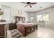 Main bedroom with wood furniture and ceiling fan at 18254 W Via Montoya Dr, Surprise, AZ 85387