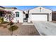 Single-story home with attached garage and desert landscaping at 18254 W Via Montoya Dr, Surprise, AZ 85387