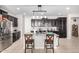 Kitchen with dark cabinets and granite countertops at 18254 W Via Montoya Dr, Surprise, AZ 85387