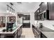 Kitchen with stainless steel appliances and island at 18254 W Via Montoya Dr, Surprise, AZ 85387