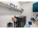 Laundry room with washer, dryer, and overhead shelving at 18254 W Via Montoya Dr, Surprise, AZ 85387