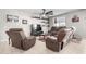 Living room with two brown recliner sofas at 18254 W Via Montoya Dr, Surprise, AZ 85387