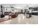 Open living and kitchen area with tile floor and recliner at 18254 W Via Montoya Dr, Surprise, AZ 85387