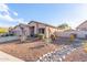 House exterior with desert landscaping at 18645 W Mcneil St, Goodyear, AZ 85338