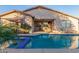 Relaxing pool and spa area with patio and home access at 18645 W Mcneil St, Goodyear, AZ 85338