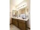 Bathroom with double vanity and wood cabinets at 206 W Caroline Ln, Tempe, AZ 85284