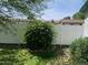 Backyard featuring a white picket fence, mature trees, landscaping and flowers at 2207 W Hayward Ave, Phoenix, AZ 85021