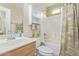 Clean bathroom with tub shower combo and storage at 2207 W Hayward Ave, Phoenix, AZ 85021