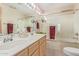 Bathroom features double vanity, shower, and tub at 2207 W Hayward Ave, Phoenix, AZ 85021