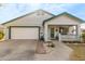 Charming single-story home with a green trimmed roof and a two-car garage at 2207 W Hayward Ave, Phoenix, AZ 85021