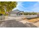 House with a white picket fence and gate, and a driveway at 2207 W Hayward Ave, Phoenix, AZ 85021