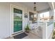 Relaxing front porch with rocking chairs and white railing at 2207 W Hayward Ave, Phoenix, AZ 85021