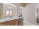 Kitchen with double sink, dishwasher and wood cabinets at 2207 W Hayward Ave, Phoenix, AZ 85021