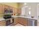 Bright kitchen with stainless steel appliances and ample cabinetry at 2207 W Hayward Ave, Phoenix, AZ 85021