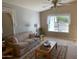 Cozy living room with neutral walls, comfortable sofa, and a large window bringing in natural light at 2207 W Hayward Ave, Phoenix, AZ 85021