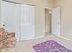 Small office space with a futon, carpet, and built-in closet at 2207 W Hayward Ave, Phoenix, AZ 85021