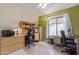 Home office with two desks, window, and ample storage at 2207 W Hayward Ave, Phoenix, AZ 85021